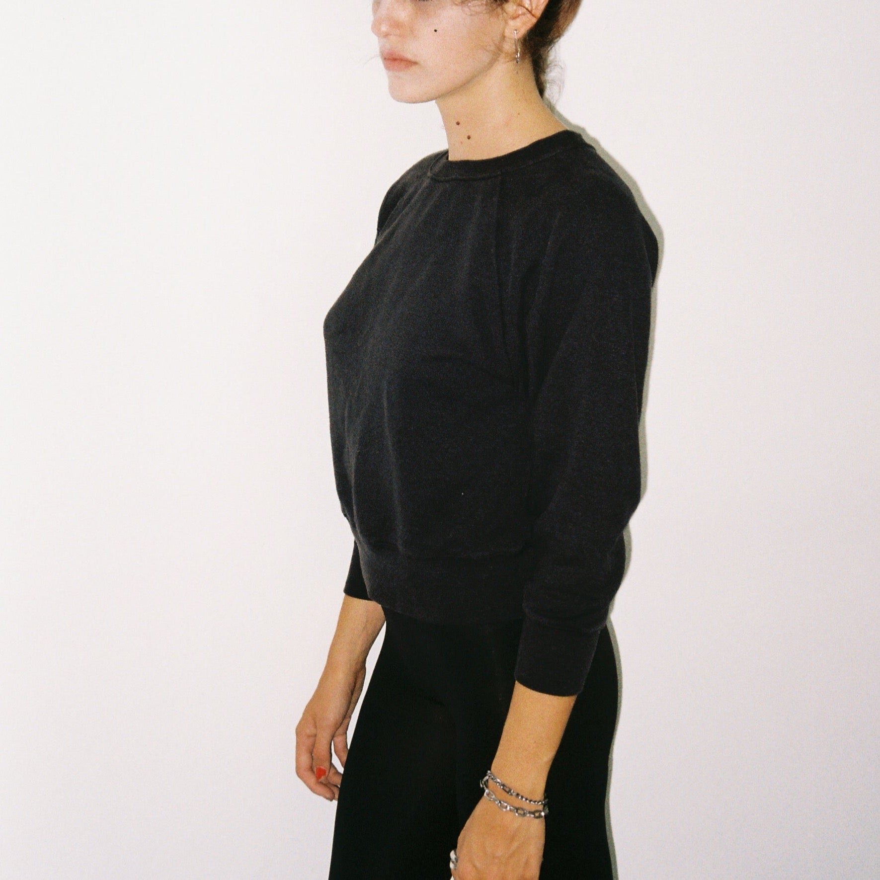 Model in Womens Raglan Crewneck in Black