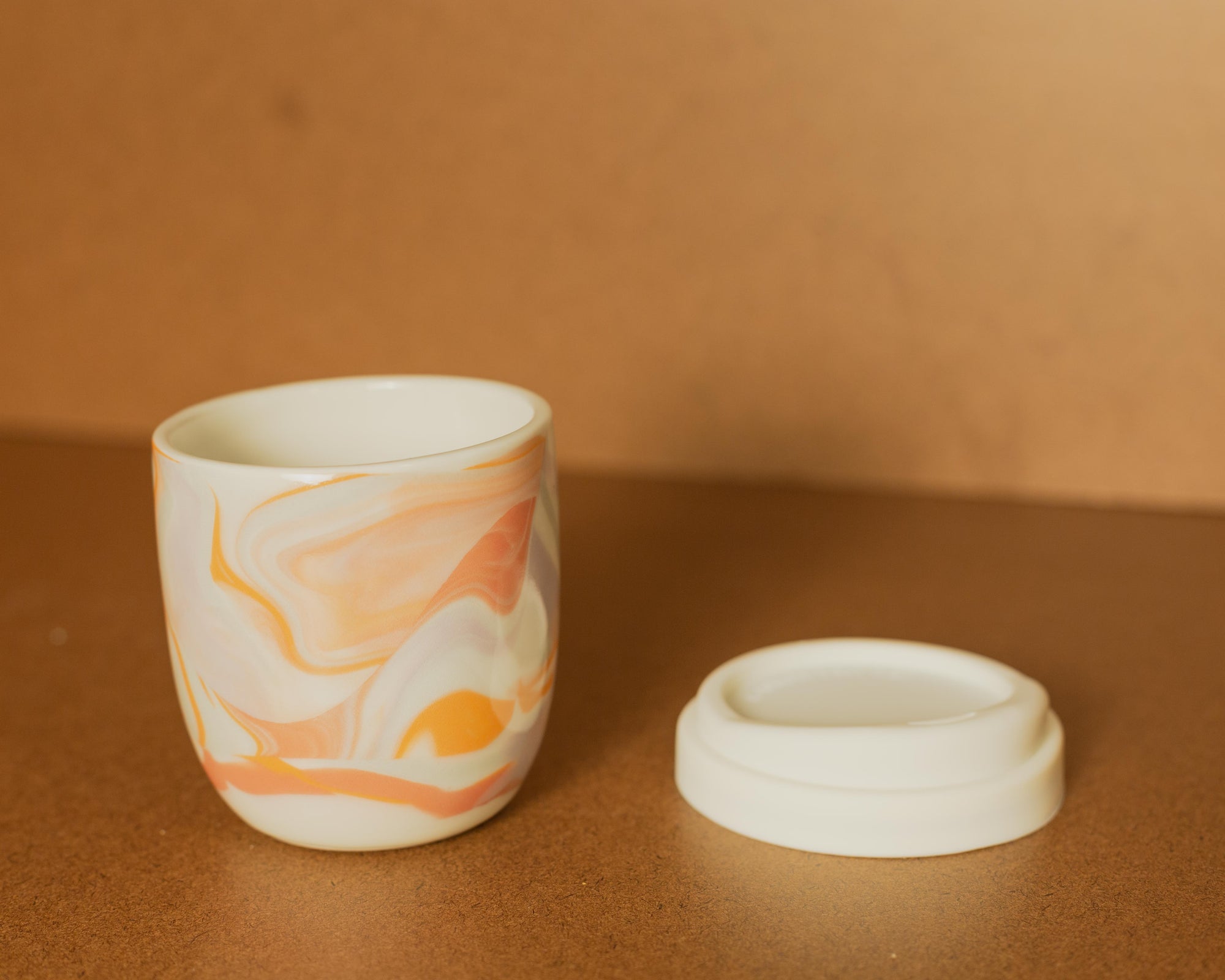 Rex Designs Marble Travel Mug w/ Lid on table