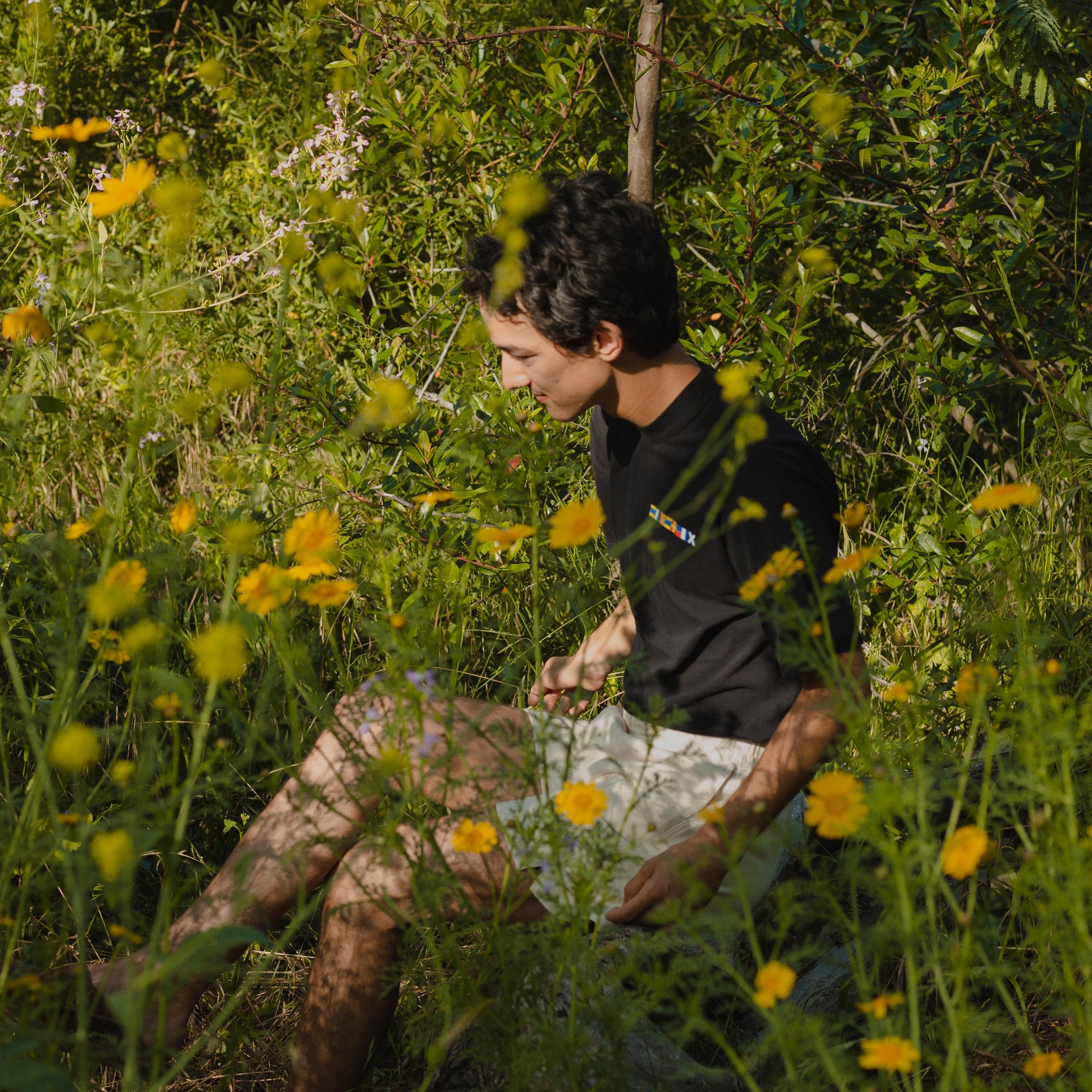 Yacht Club Graphic made up of Sailing Flags on a Black Tee in Flower Field