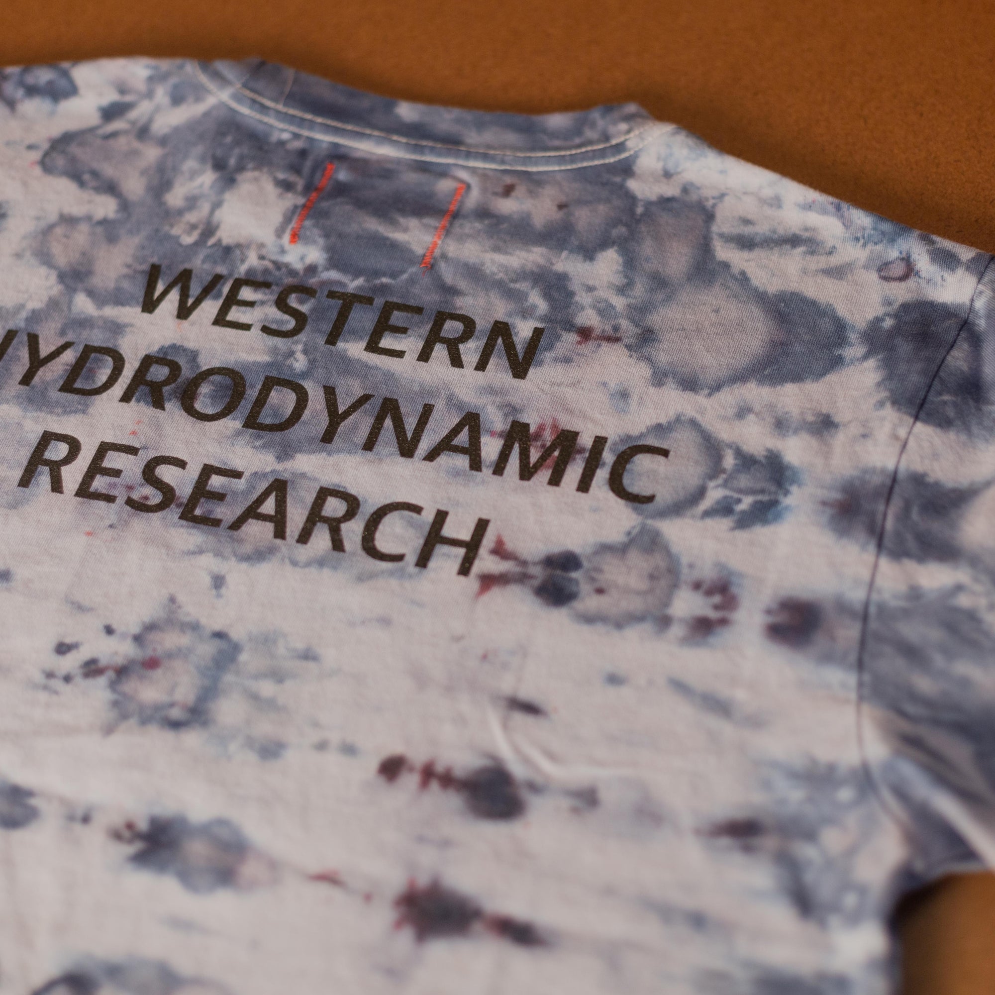 Western Hydrodynamic Research - Worker Tee (Ice Dye) back with brown background