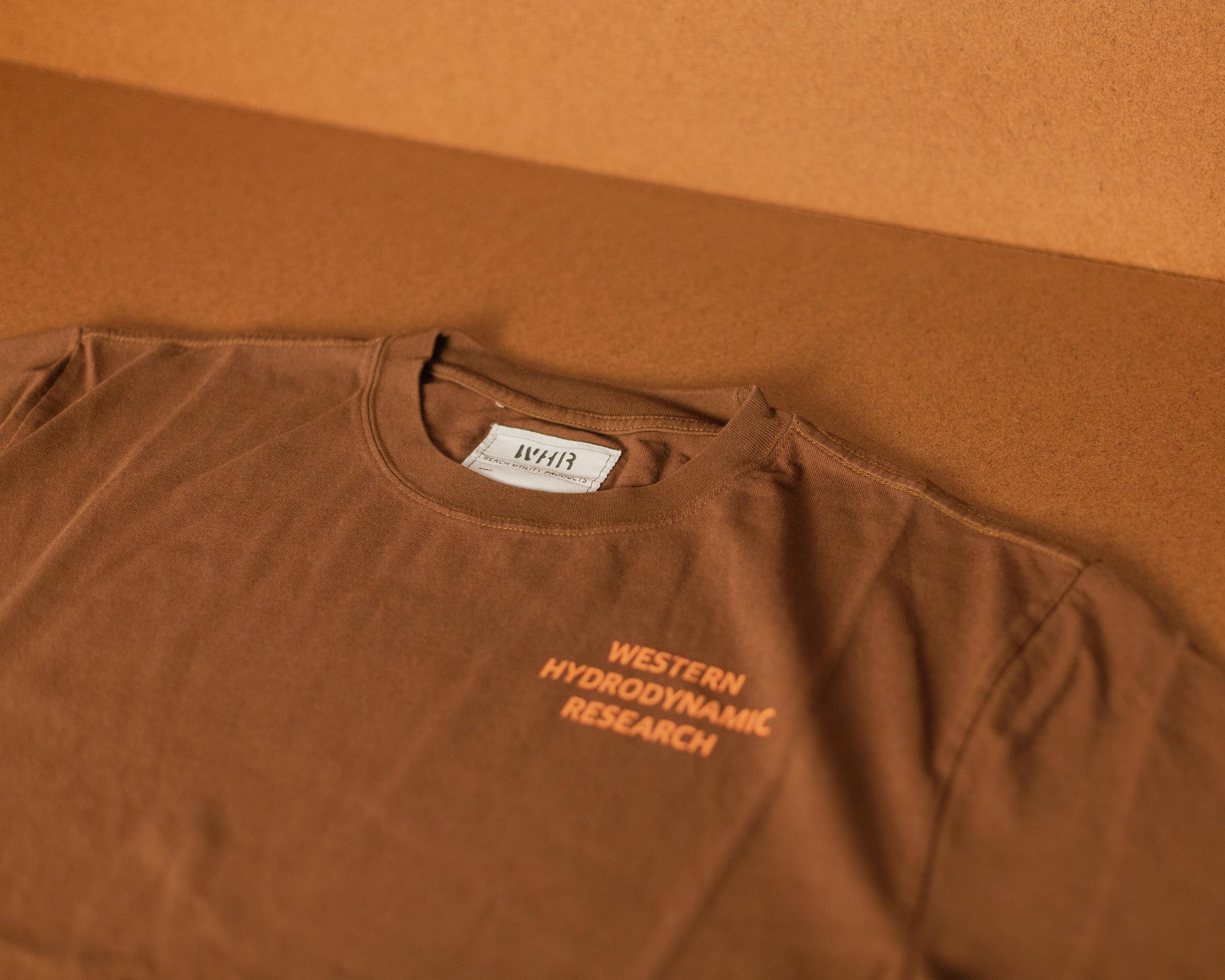 Western Hydrodynamic Research - Worker Tee (Brown) front with brown background