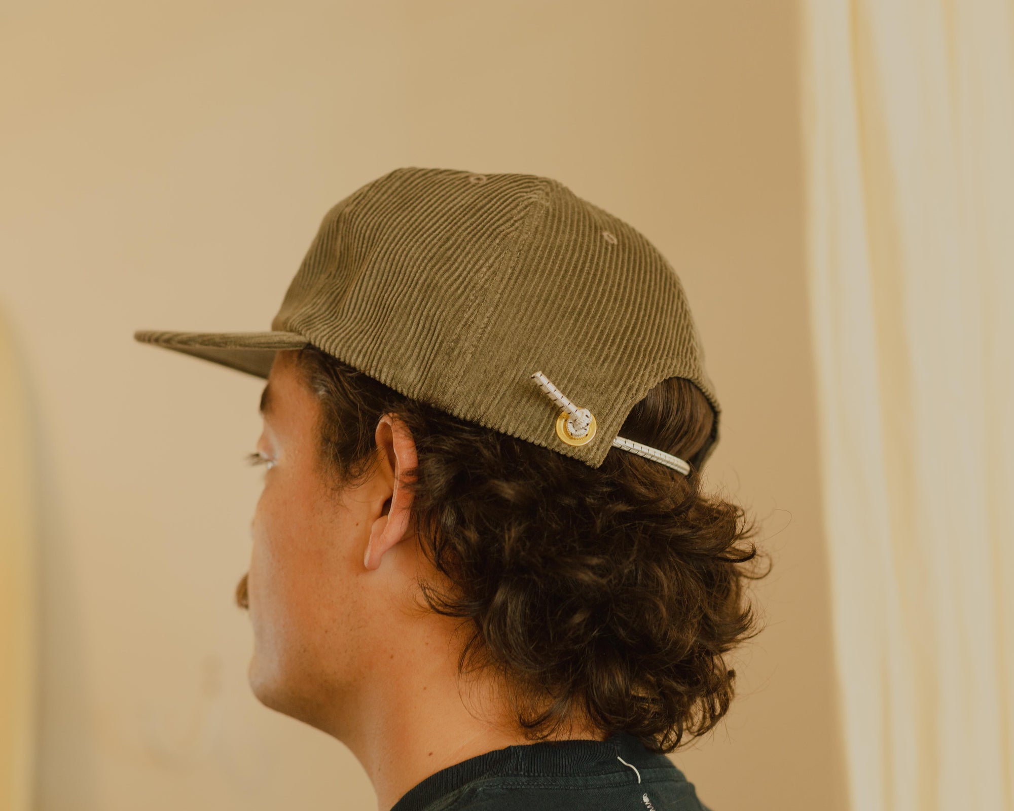 Western Hydrodynamic Research- Whale Cord Hat (Olive) side view on model