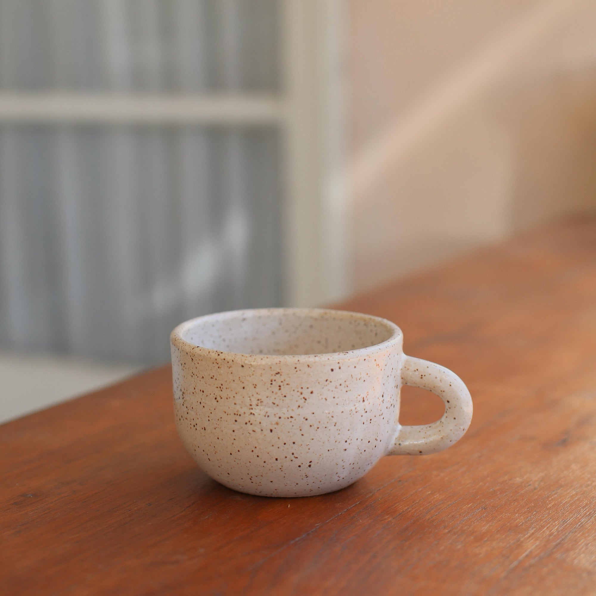 Daydream x Costa Mesa Ceramics Cappuccino Mug on wooden table