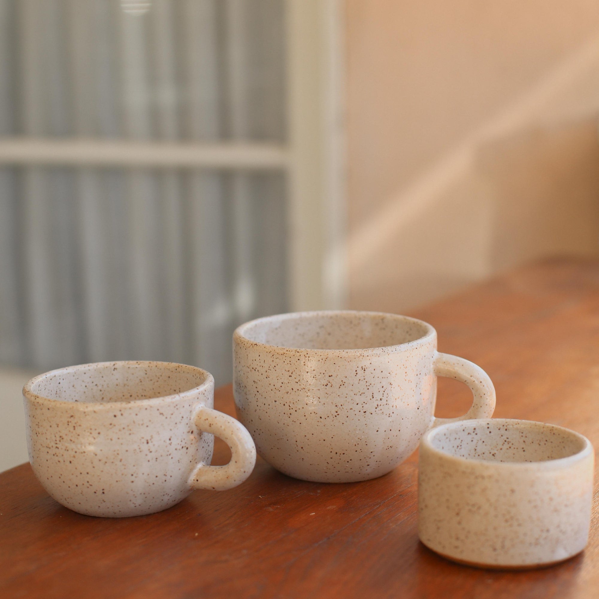 Daydream x Costa Mesa Ceramics Latte Mugs on wood table